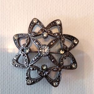 LC silver and rhinestone brooch.